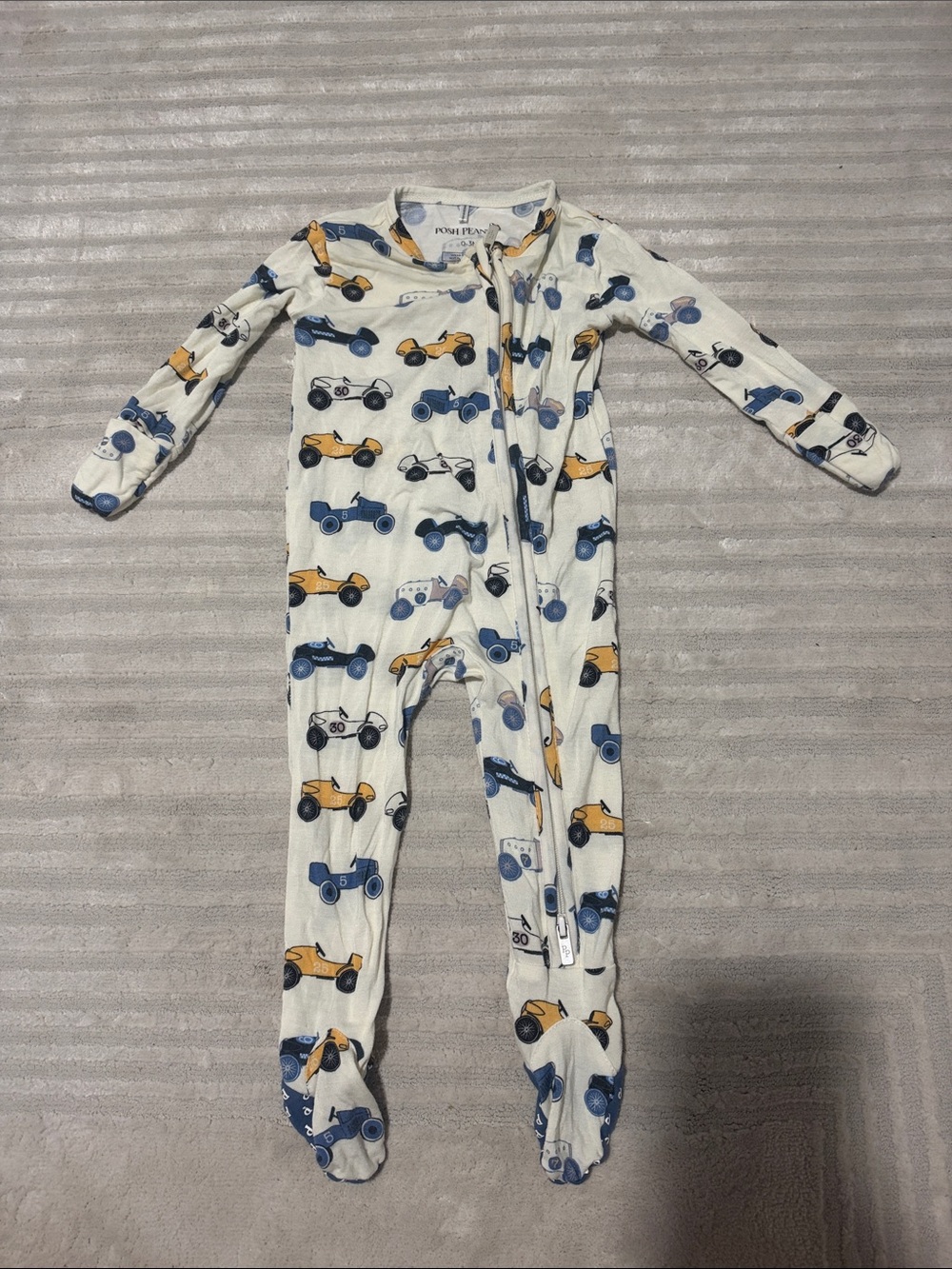 Posh Peanut Cream Footie with Blue and Yellow Race Cars